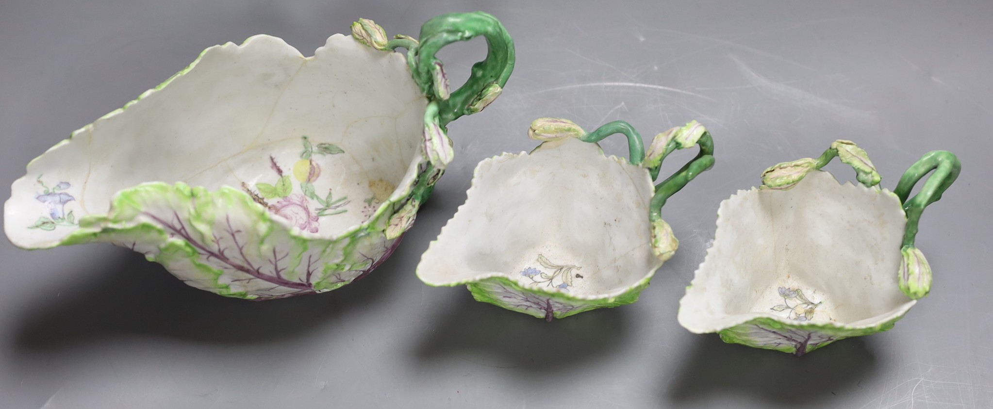 A Longton Hall cabbage leaf sauceboat and two similar creamboats, c.1755, faults and Newhall type tea wares, largest jug 22 cms wide